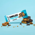 Junkless Protein Chocolate Chip Cookie Dough bar with packaging on a light blue background