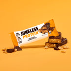 Junkless Protein chocolate peanut butter bar on a yellow background