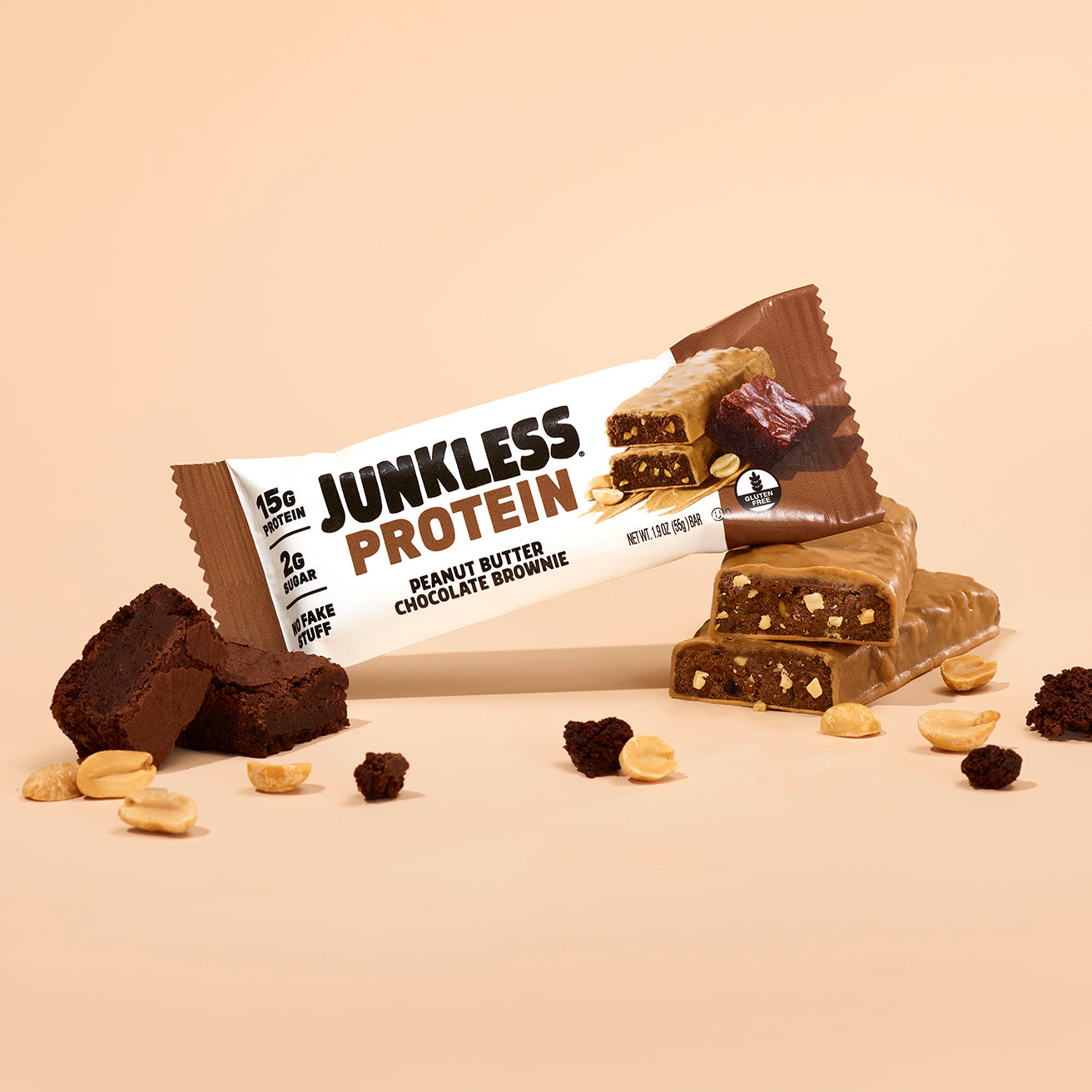 Junkless Protein Peanut Butter Chocolate Brownie bar on a beige background