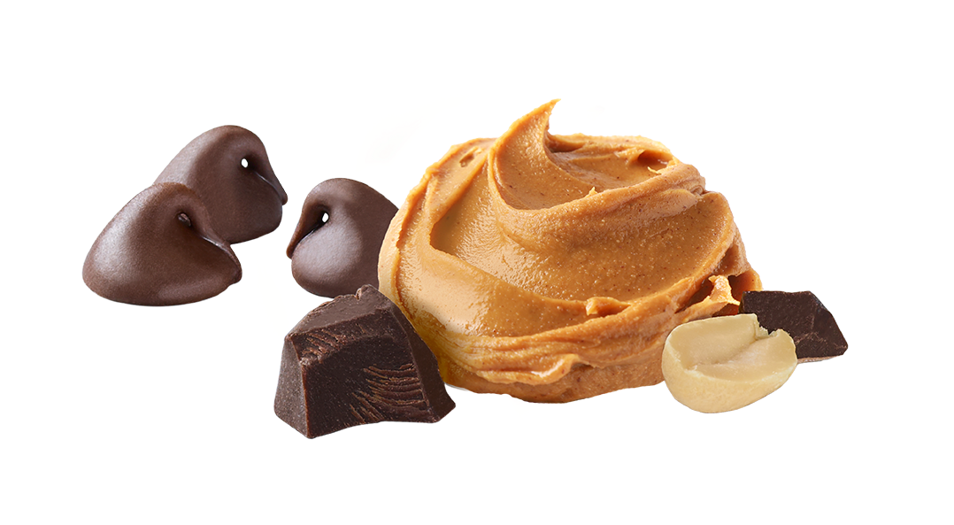 Swirl of peanut butter with chocolate pieces on a white background