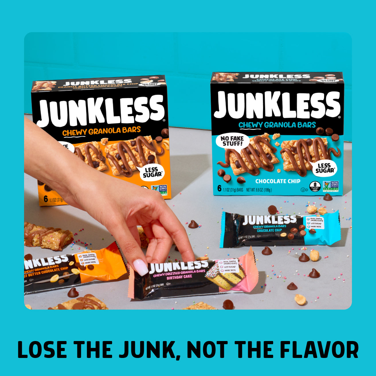 Junkless chewy granola bars packaging with a hand holding a bar on a blue background