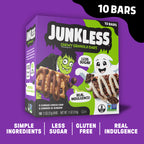 A box of Junkless Chewy Granola Bars on a purple background with promotional text. The box is purple and green with Halloween-themed graphics, showing chocolate-covered granola bars.
