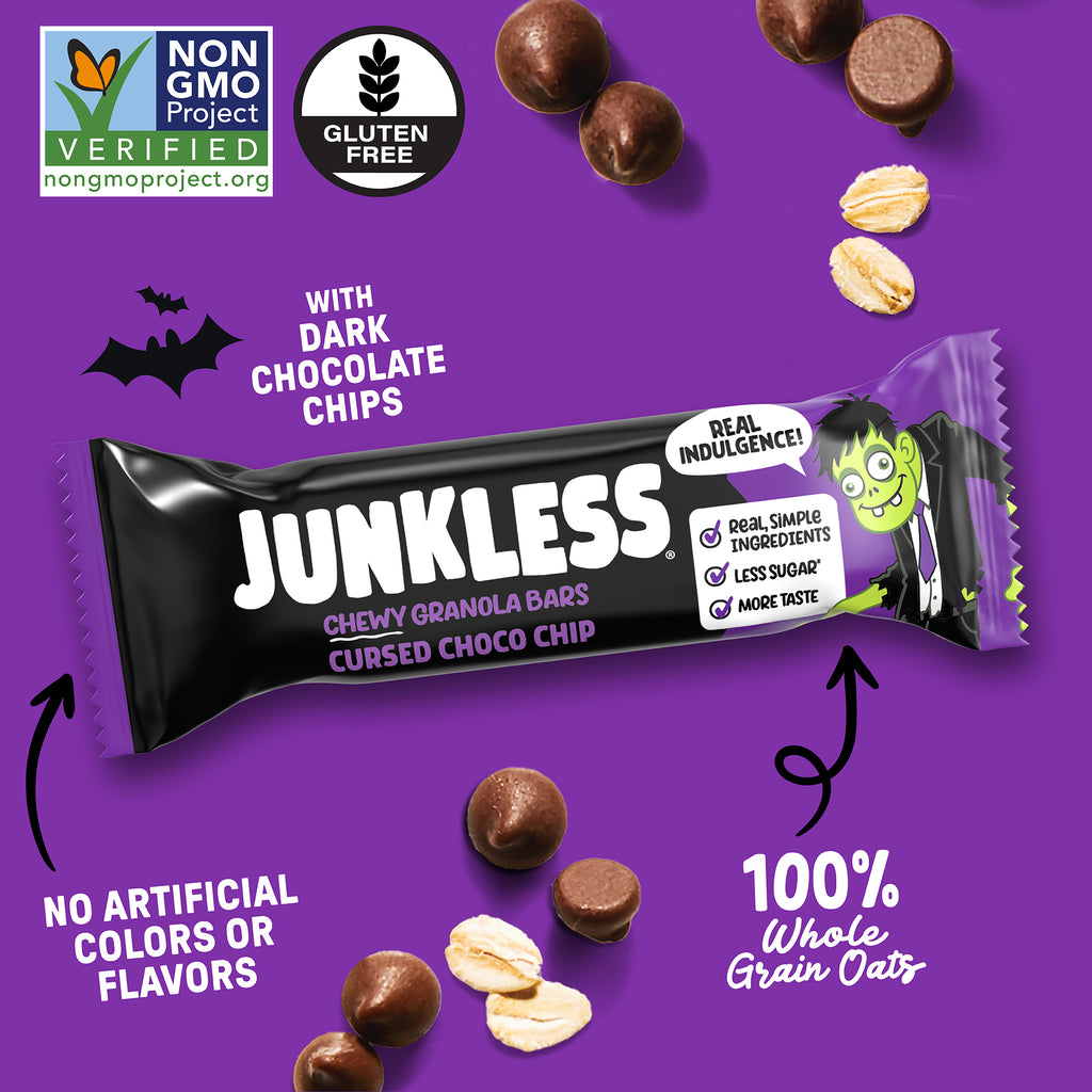 A wrapped Junkless Chewy Granola Bar shown on a purple promotional background with scattered chocolate chips and oats. The wrapper is black and purple with large white 'JUNKLESS' branding and smaller text reading 'Chewy Granola Bars' and 'Cursed Choco Chip.
