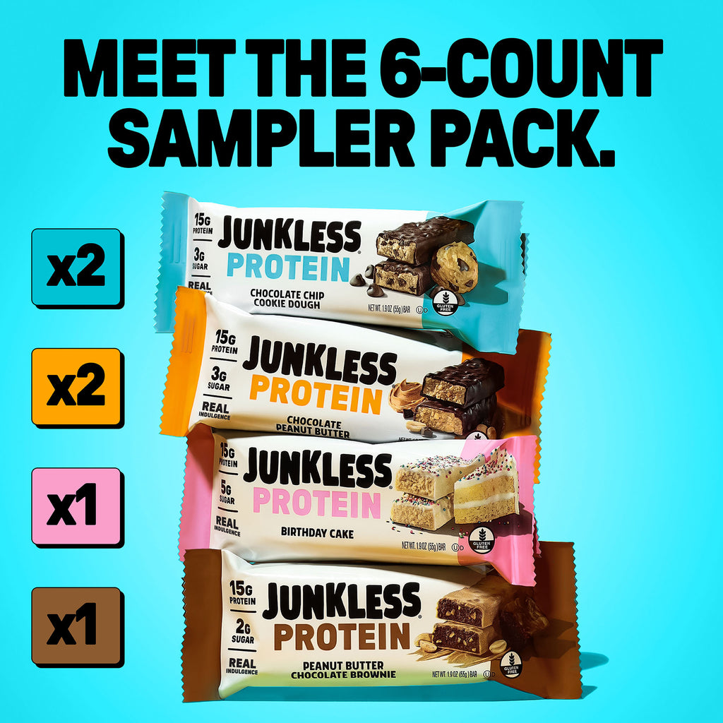 4 Junkless protein bars stacked on top of one another on a blue background