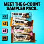 4 Junkless protein bars stacked on top of one another on a blue background
