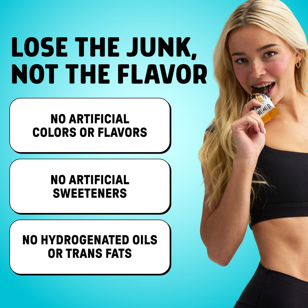 Livvy Dunne taking a bite out of a Junkless protein bar on a blue background