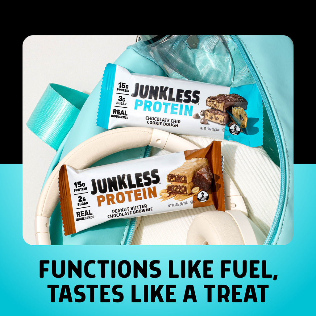 A chocolate chip cookie dough and brownie protein bar in a gym back with head phones on a black and white background