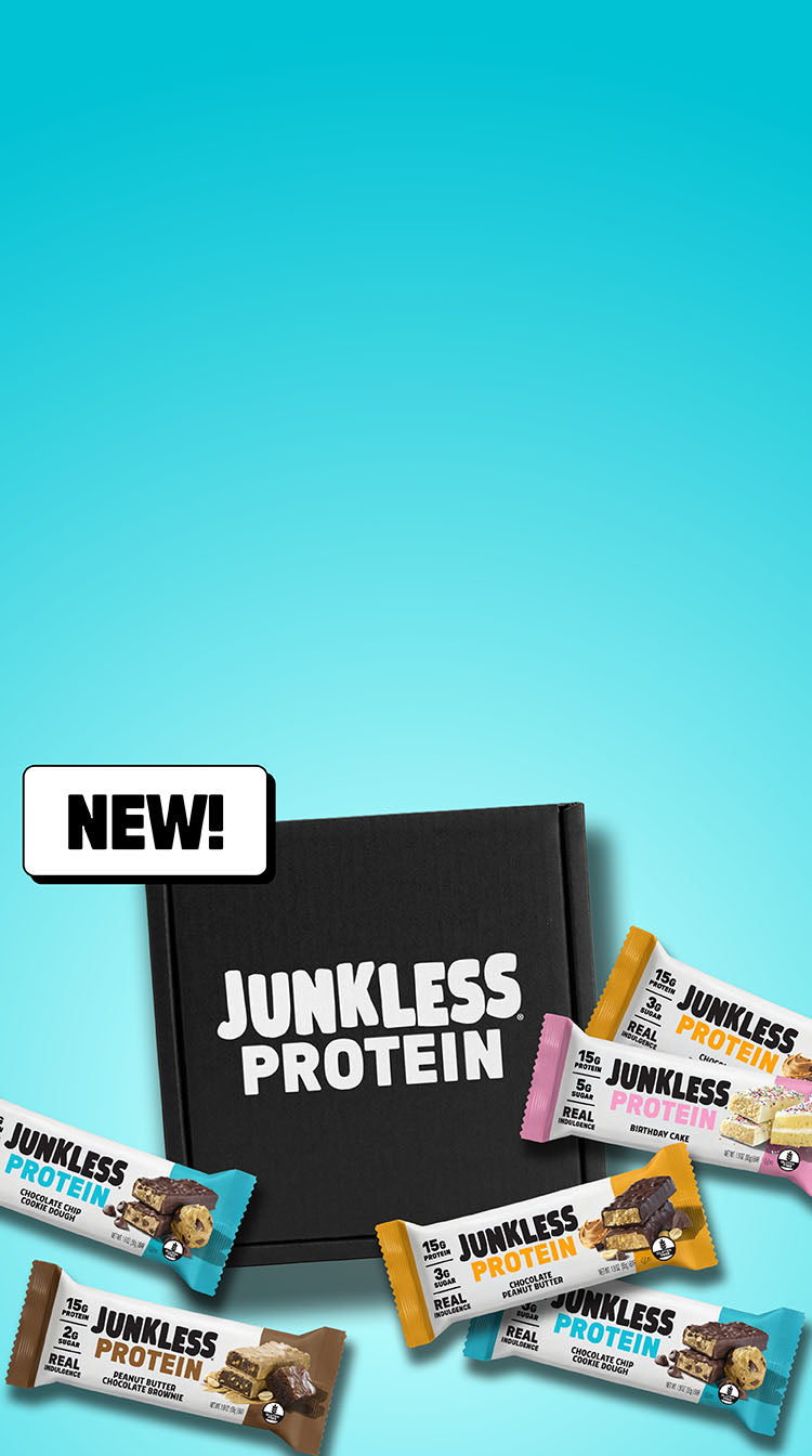 Scattered wrapper protein bars next to a black box on a blue background