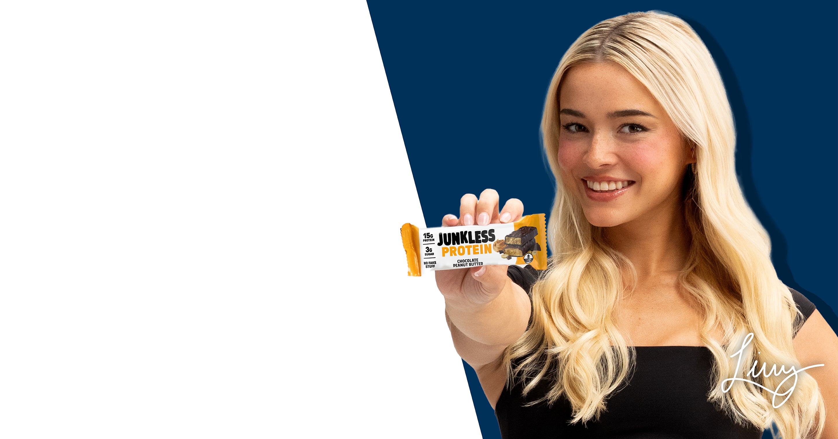 A smiling blonde woman in a black top holds up a JUNKLESS Protein bar wrapper against a split white and dark blue background.