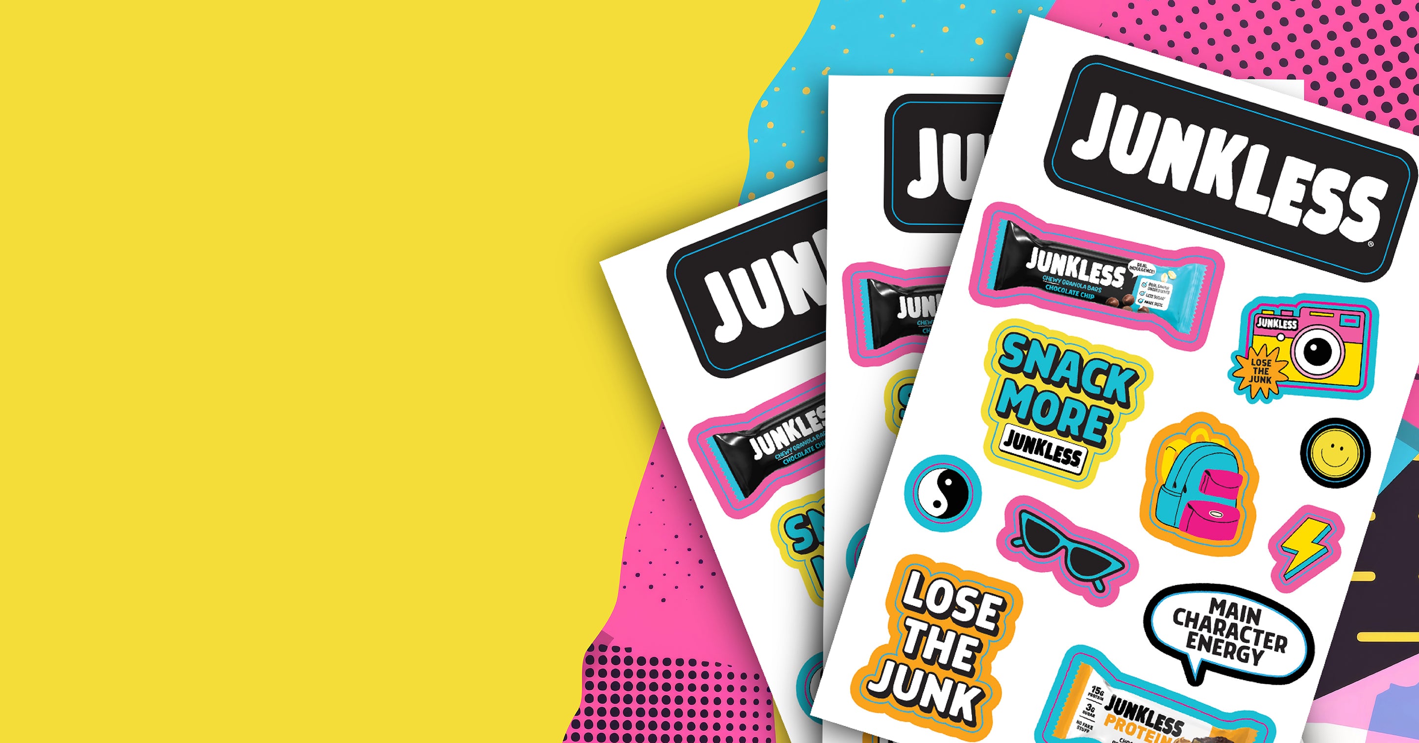 Three sheets of Junkless stickers fanned out on a bright yellow background with colorful geometric pattern accents. The stickers feature retro-style icons and phrases like 'SNACK MORE JUNKLESS', 'LOSE THE JUNK', and 'MAIN CHARACTER ENERGY'.