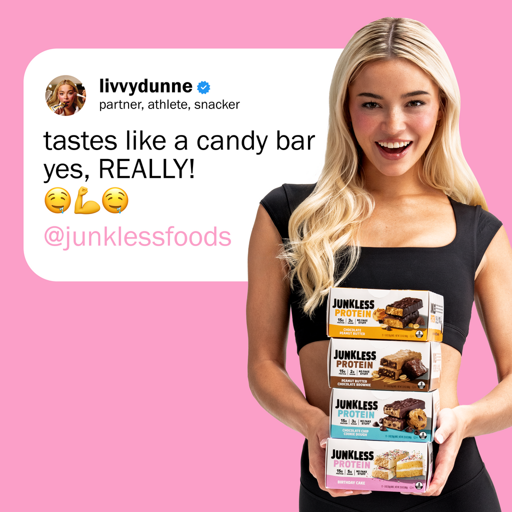 Woman holding Junkless protein bars with a pink background and social media text overlay.