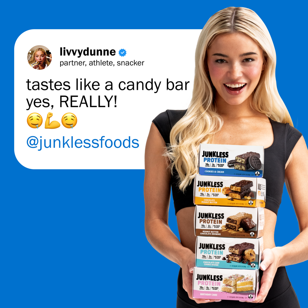 Woman holding Junkless protein bars with a blue background and social media text overlay.
