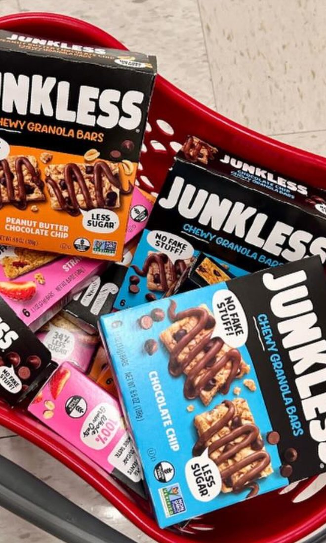 junkless granola bar boxes in a target shopping basket on the floor