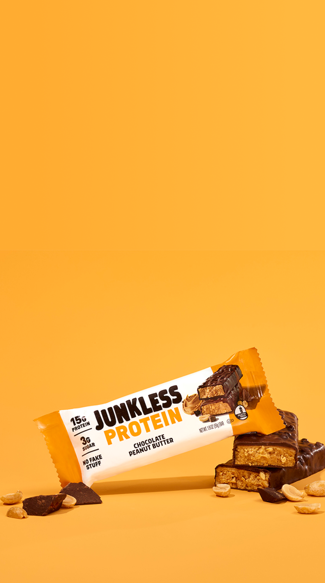 Junkless Protein bar with chocolate and peanut butter flavor on a yellow background