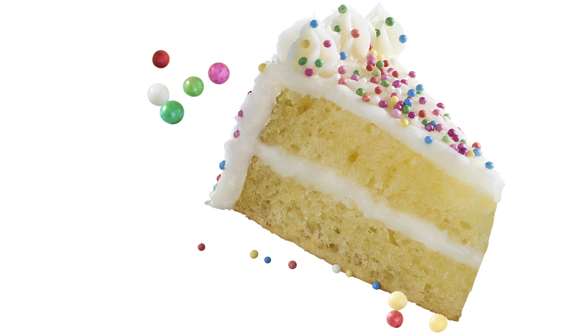 Slice of cake with white frosting and colorful sprinkles on a white background
