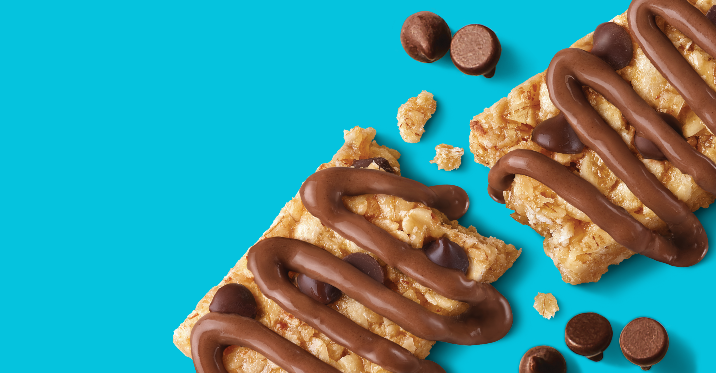 Granola bar with chocolate drizzle on a blue background