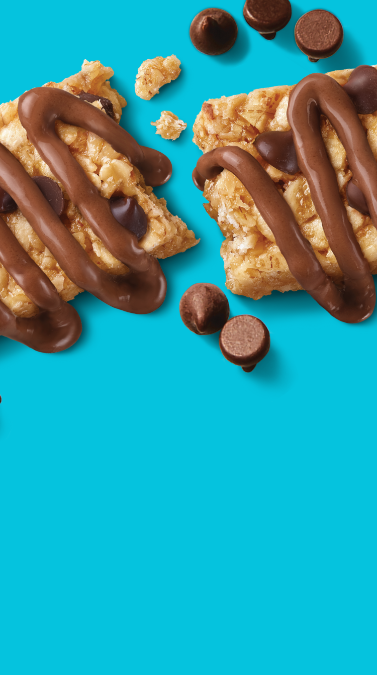 Granola bar with chocolate drizzle on a blue background
