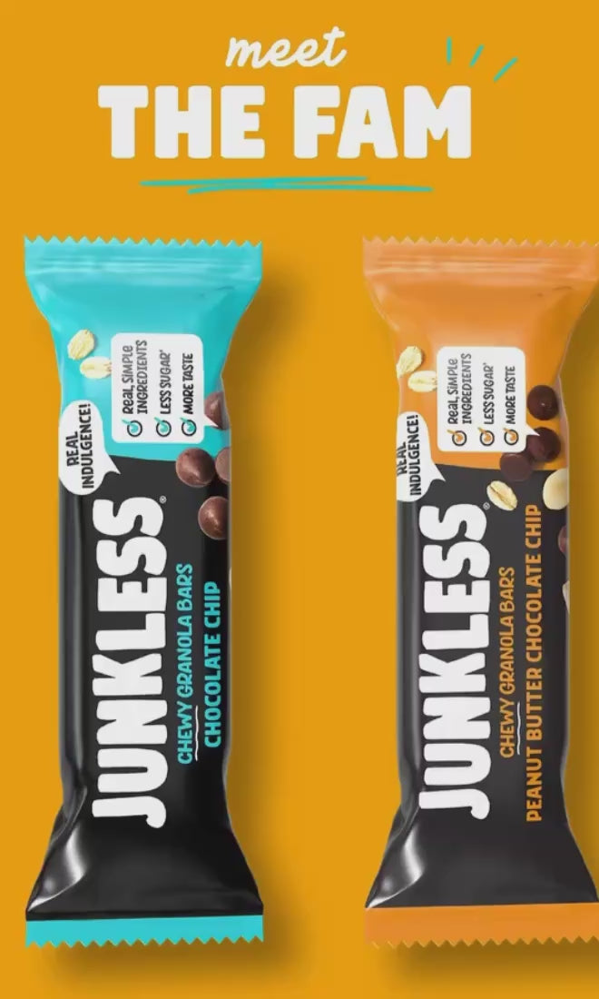 junkless granola bars on an orange background standing next to each other